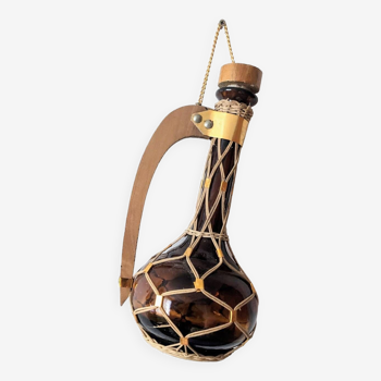 Amber glass carafe woven with wicker wooden handle