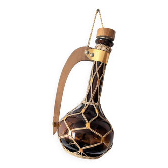 Amber glass carafe woven with wicker wooden handle