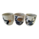 Set of three hand-painted porcelain cups with floral patterns.