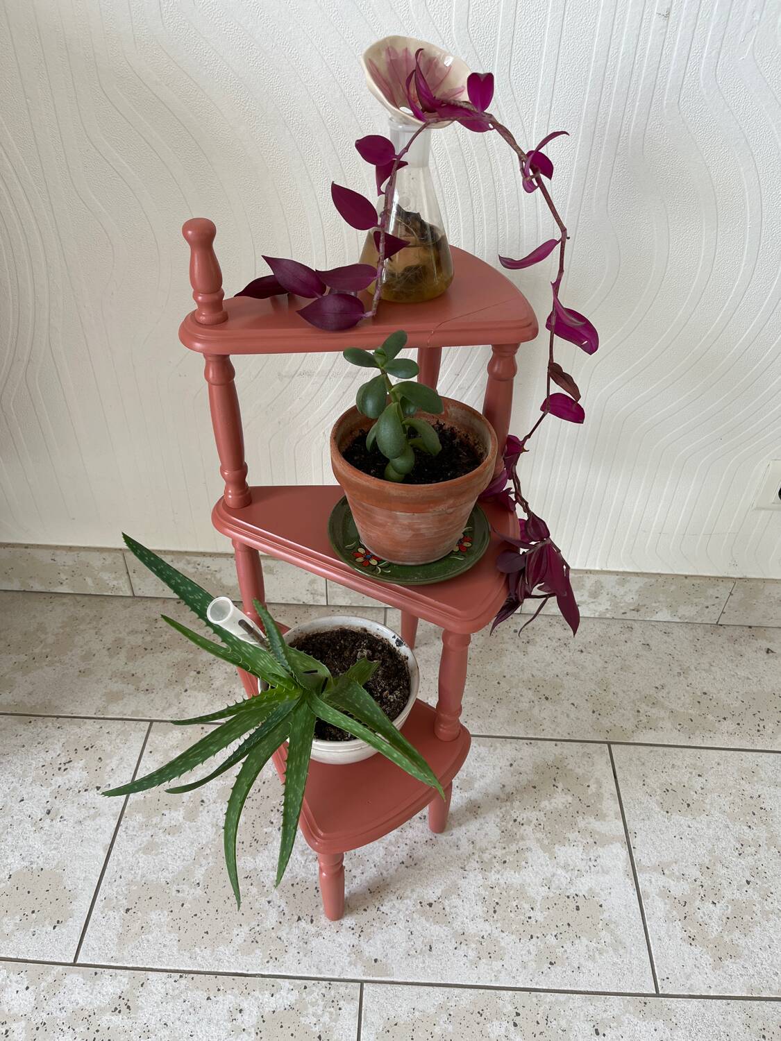 Old plant holder repainted in terracotta
