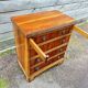 Small English chest of drawers with a folding top.
