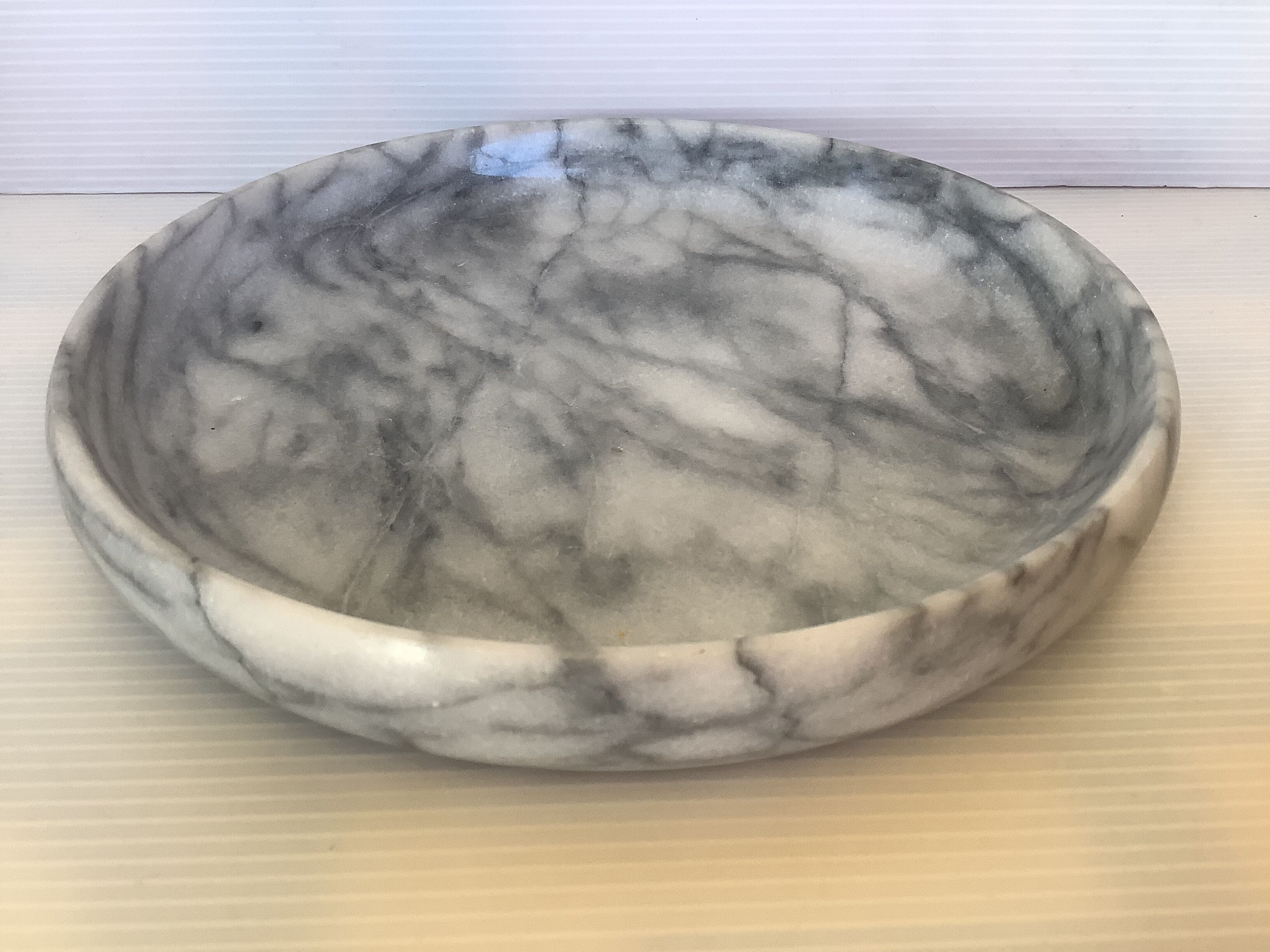 Empty round pocket in gray marble