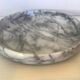 Empty round pocket in gray marble