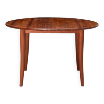 Dining table with a solid teak extension