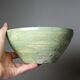 Wabi-Sabi handcrafted ceramic bowl in celadon green, 20th-19th century.