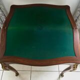 Console transforming into a 19th century Louis XV style gaming table