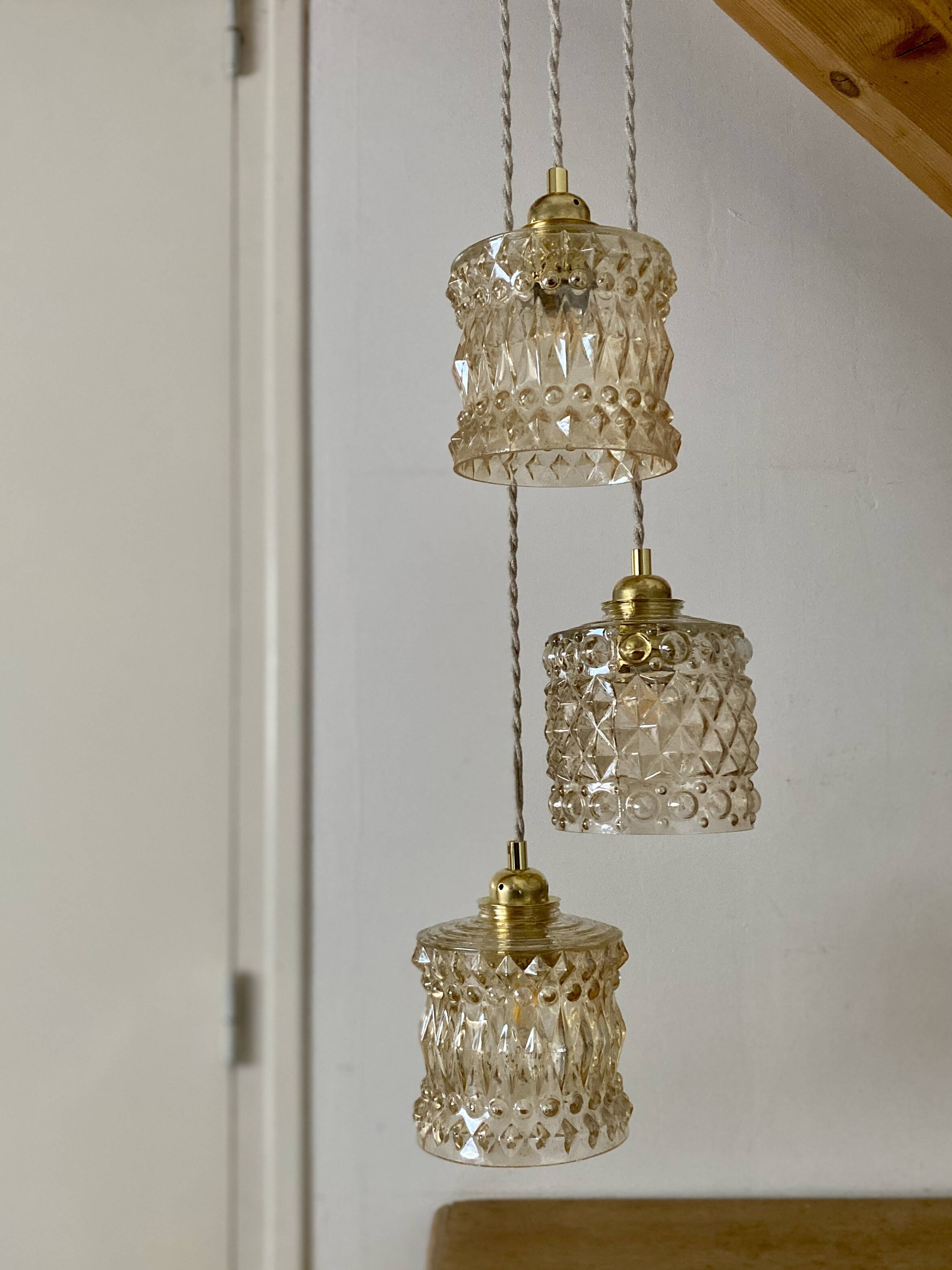 Triple antique globe pendant light in amber glass