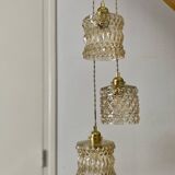 Triple antique globe pendant light in amber glass