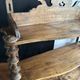 Antique wall shelf made of turned wood and spools of thread, late 19th century.