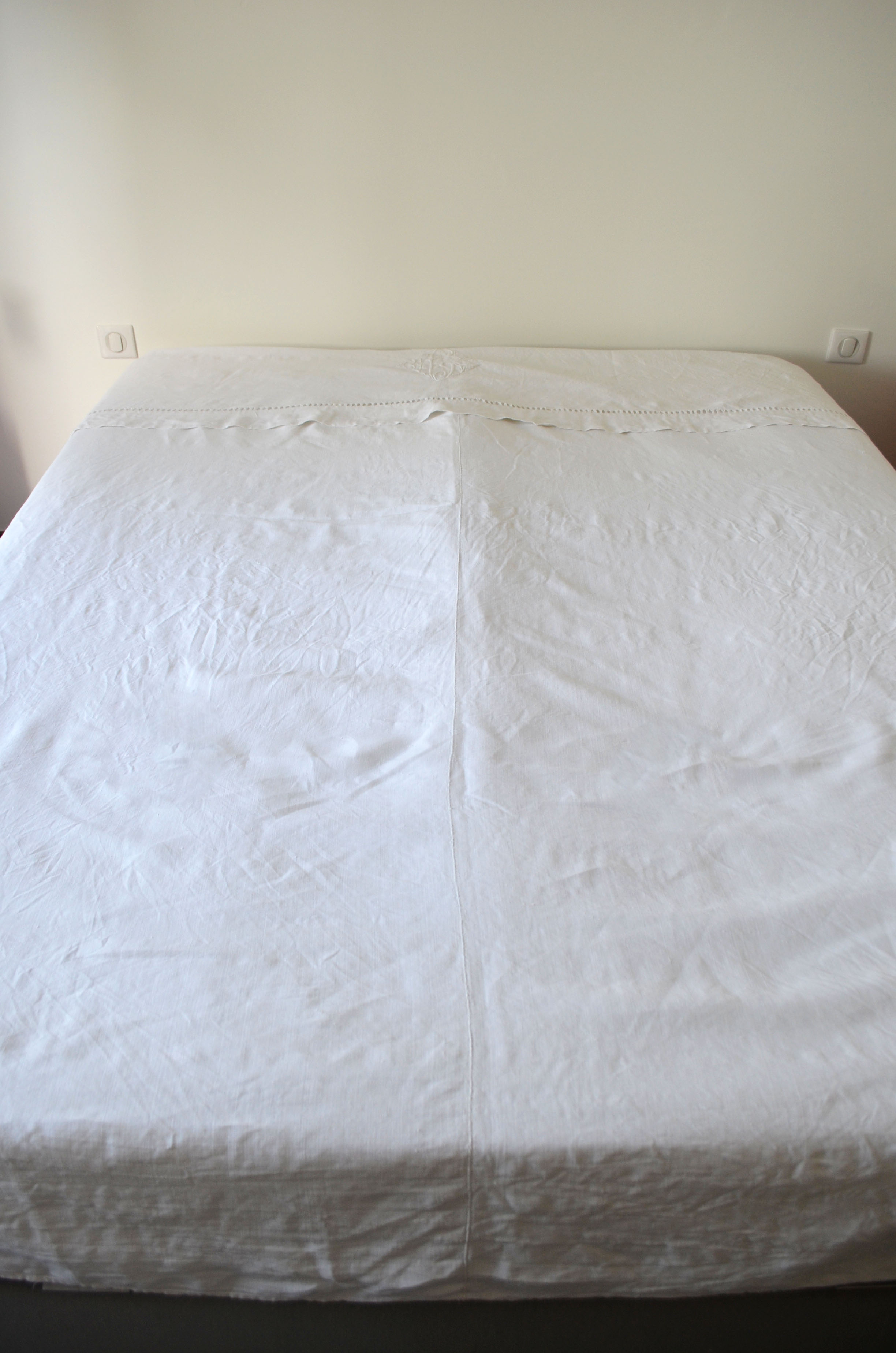 White sheet in monogrammed linen