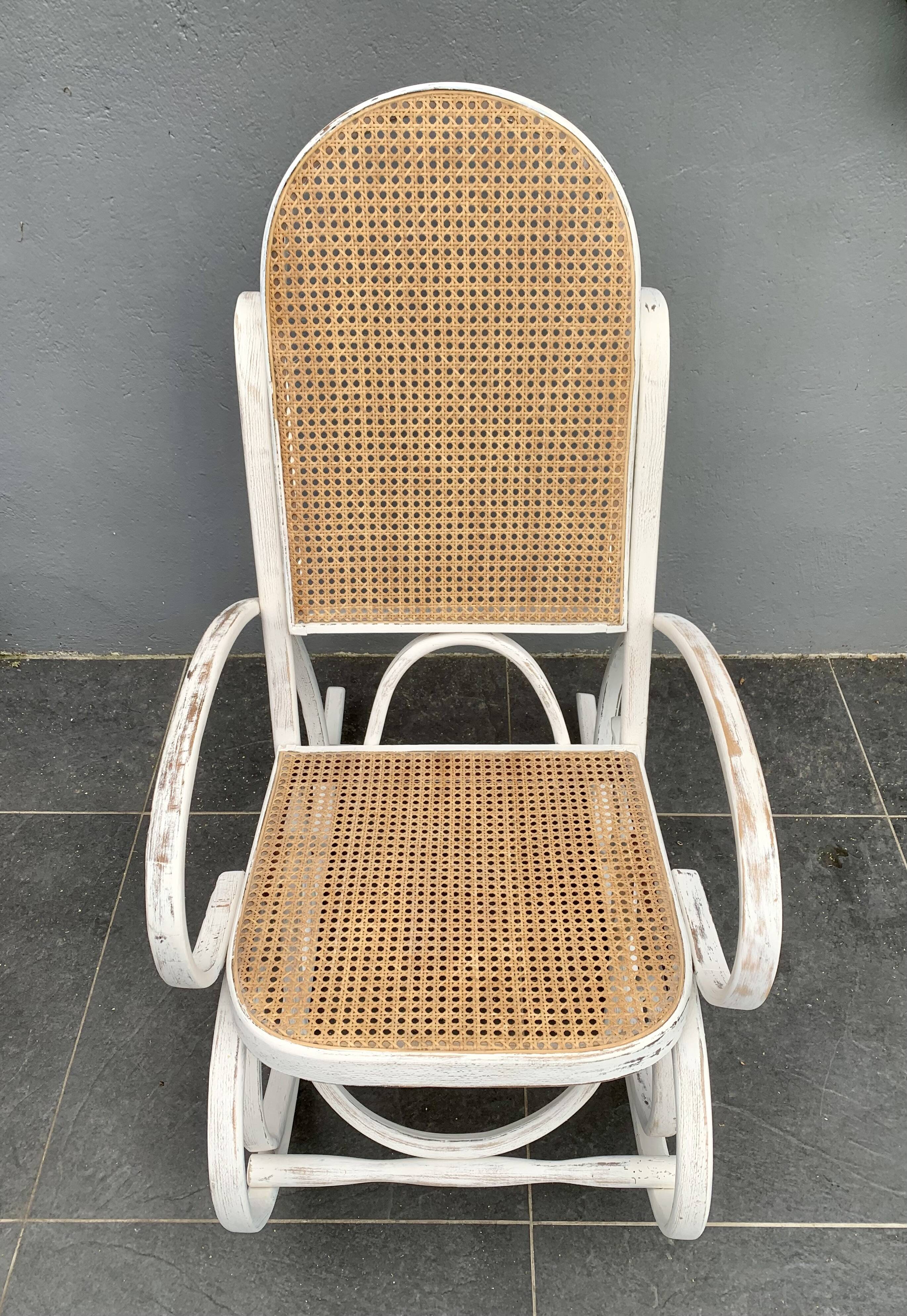 Old rocking chair with white patina