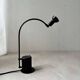 Minimalist Memphis design arc table lamp from the 80s.
