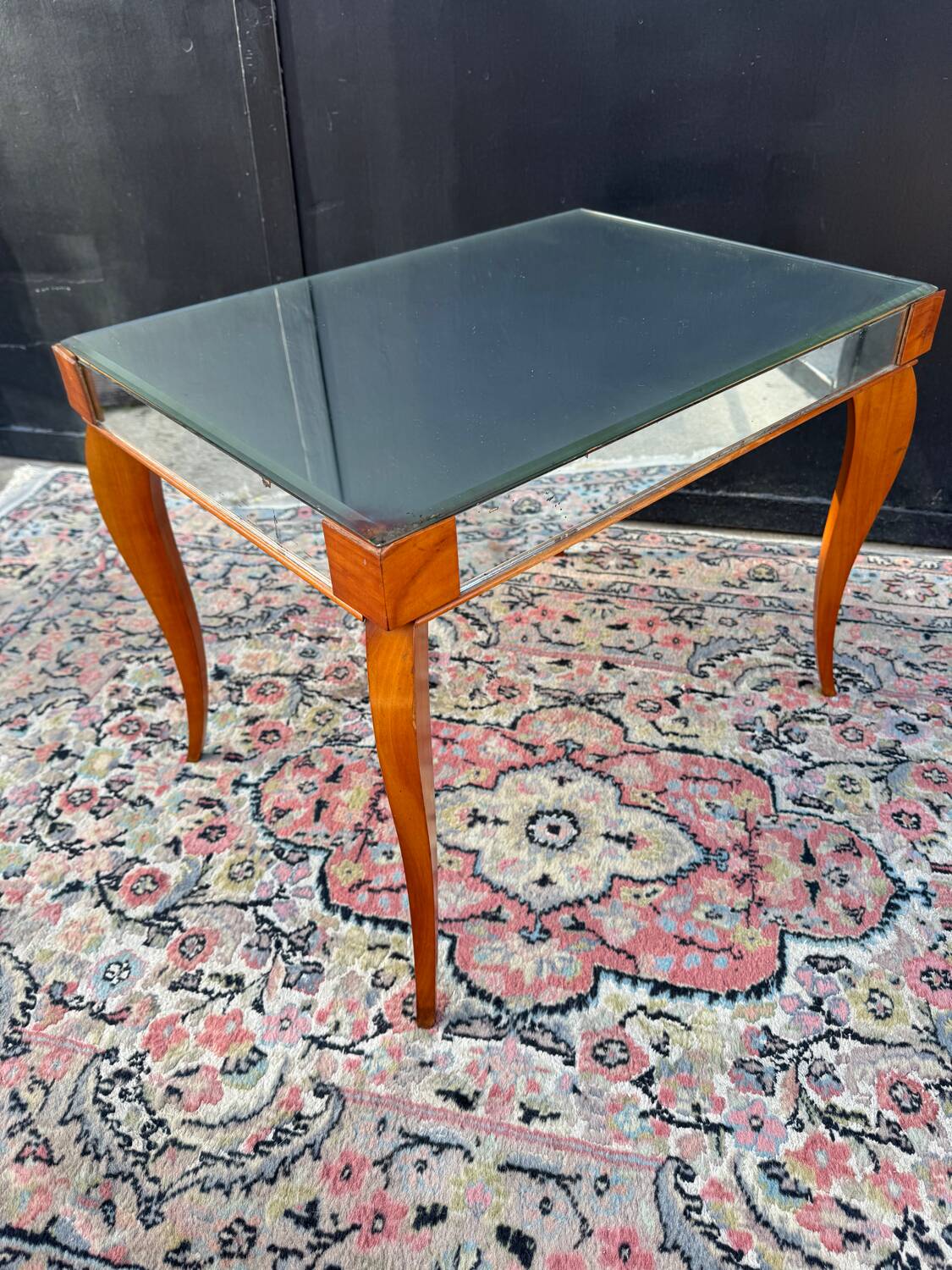 Small wooden coffee table with a mirror from the 1950s.