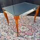 Small wooden coffee table with a mirror from the 1950s.