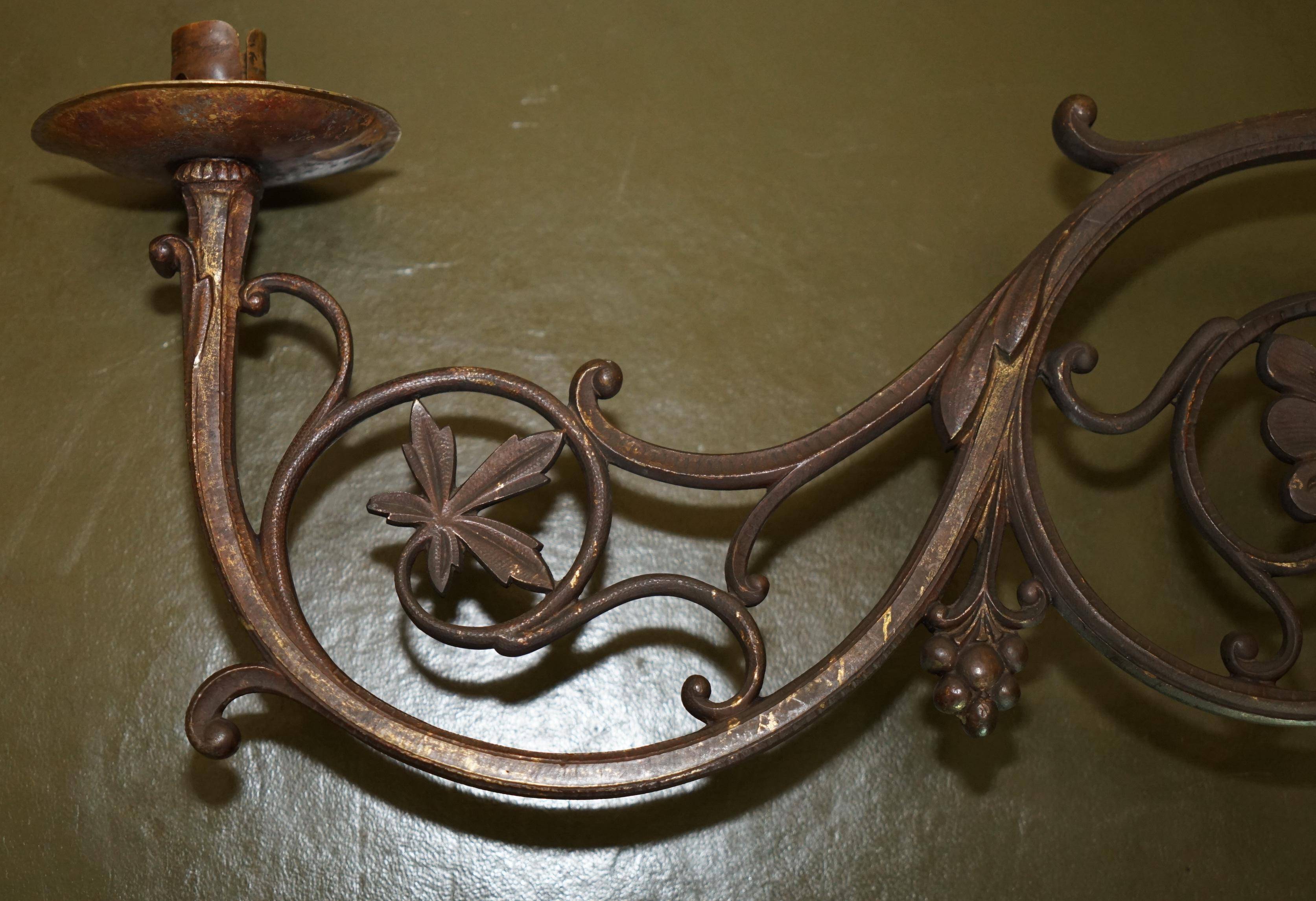 Pair of antique wall sconces in gilded bronze.