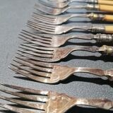 Old silver fish forks with bone handles
