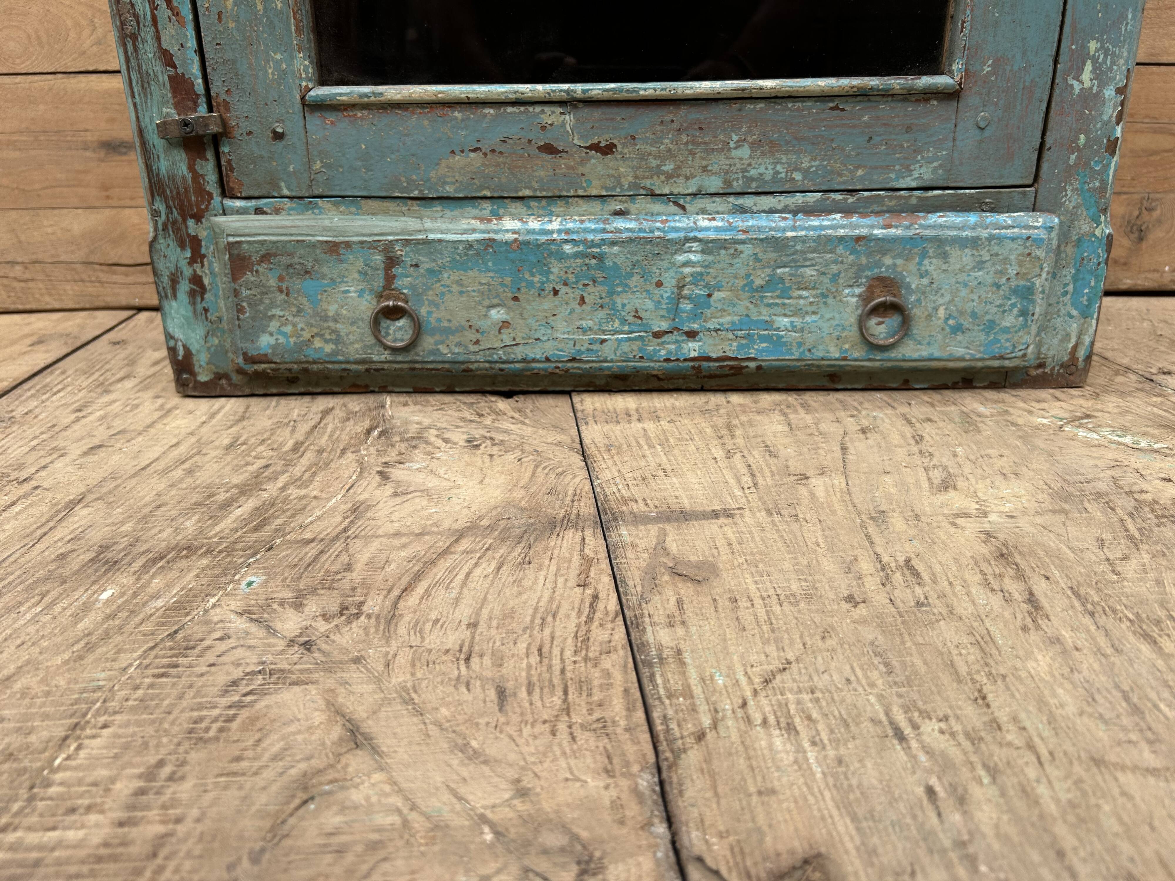 Wall display cabinet in Burmese teak with original patina.
