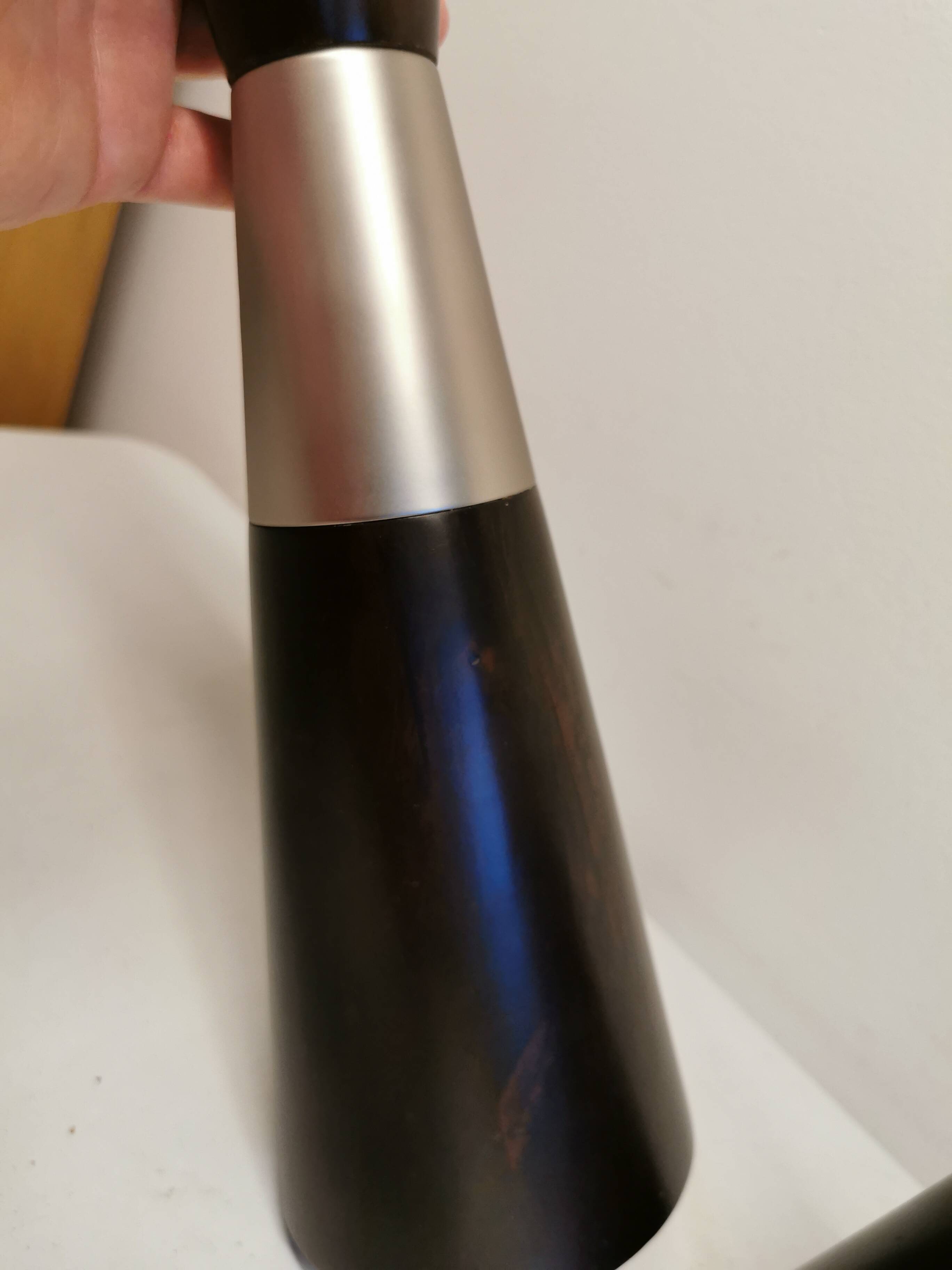 Two table lamps made of dark-stained wood with silver detail in the middle.