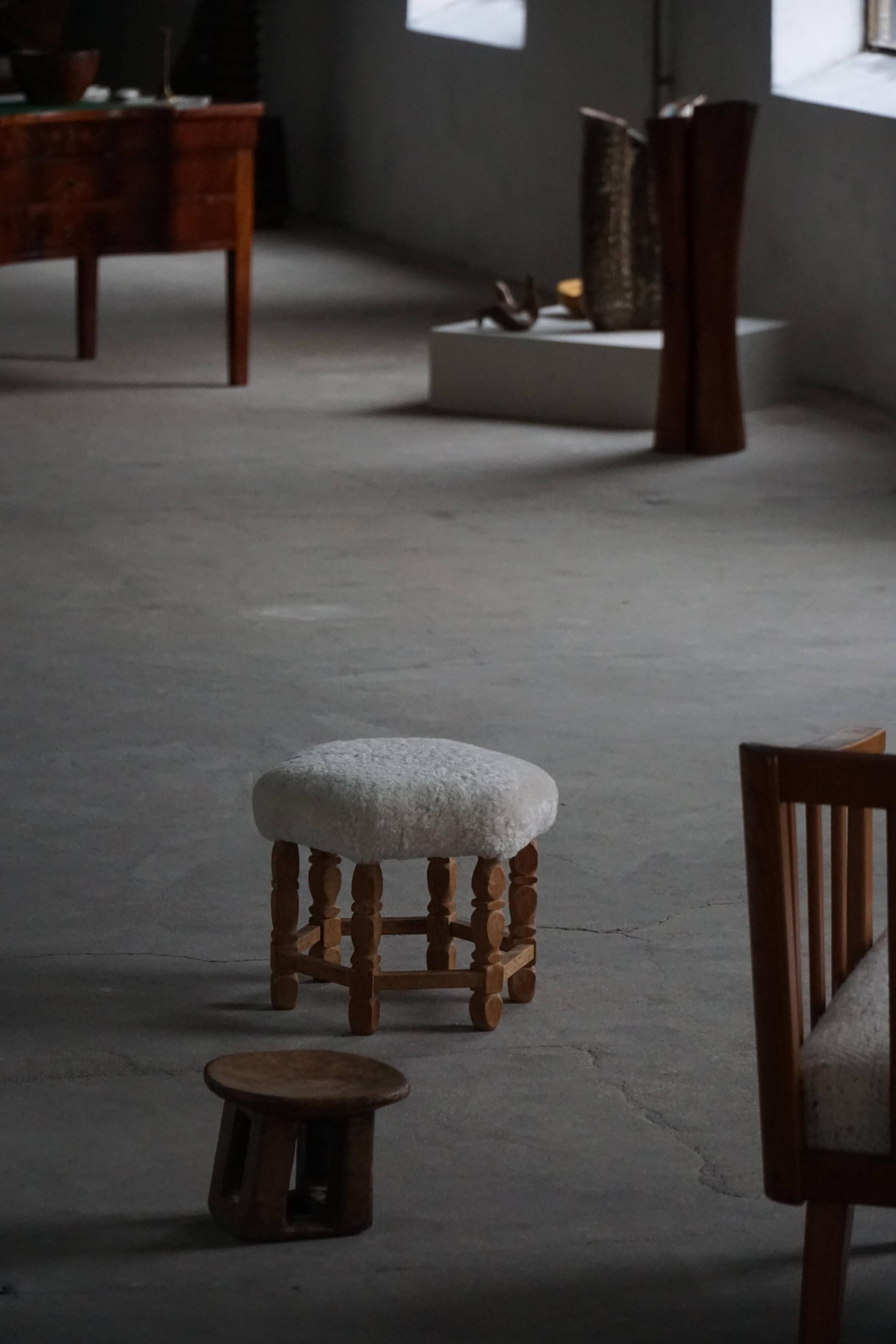 Mid-century Danish hexagonal oak stool with shearling lamb wool upholstery, 1950.