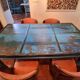 Large antique Indian dining table made of teak wood with patina.