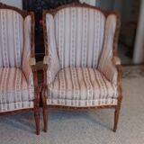 Pair of carved bergere armchairs