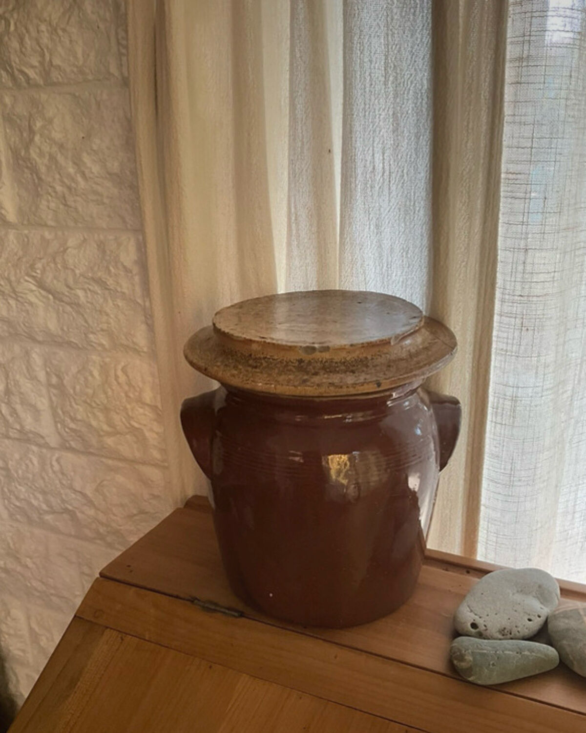 Ancient ceramic salt cellar and its lid.