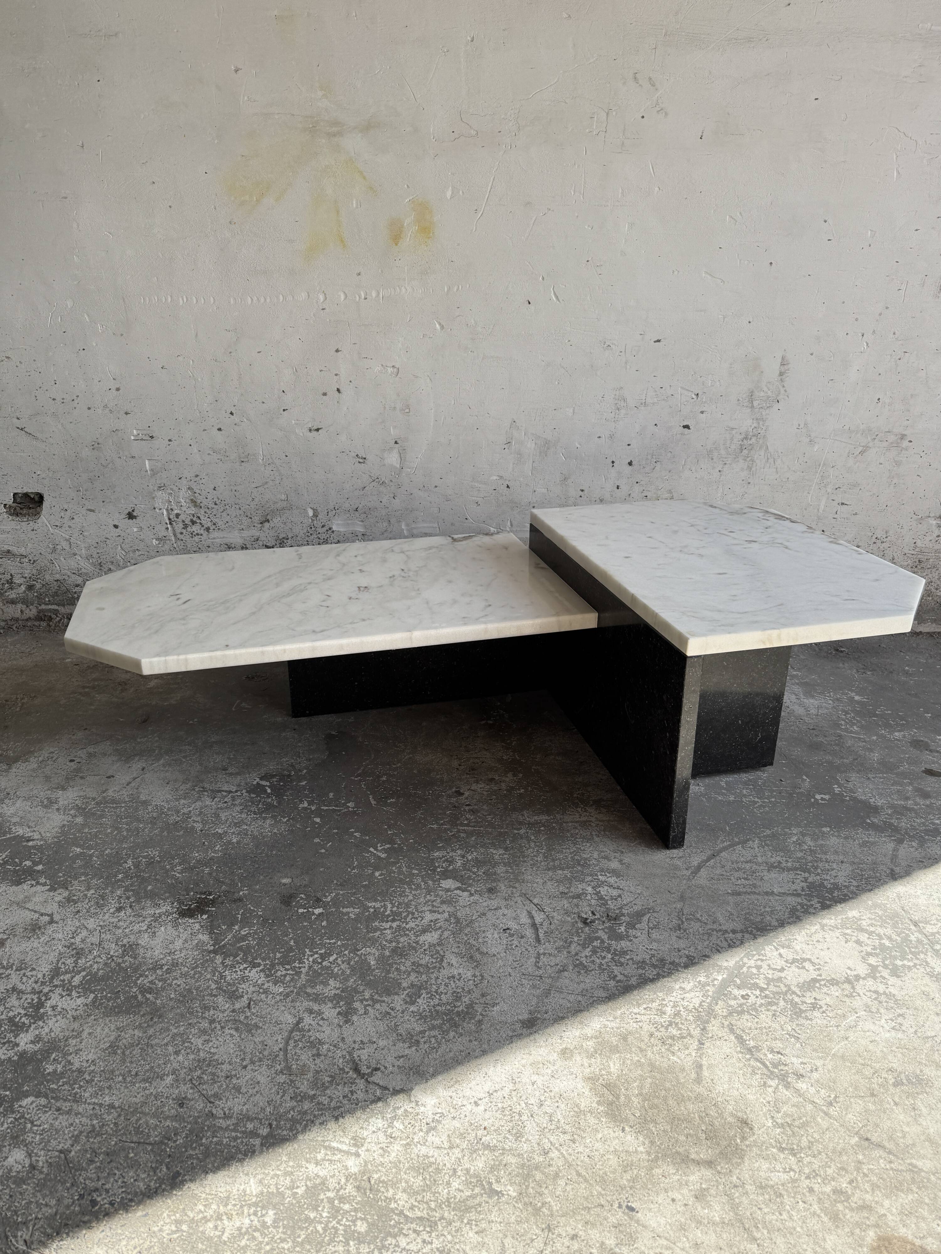 Unique postmodern coffee table in marble and granite.