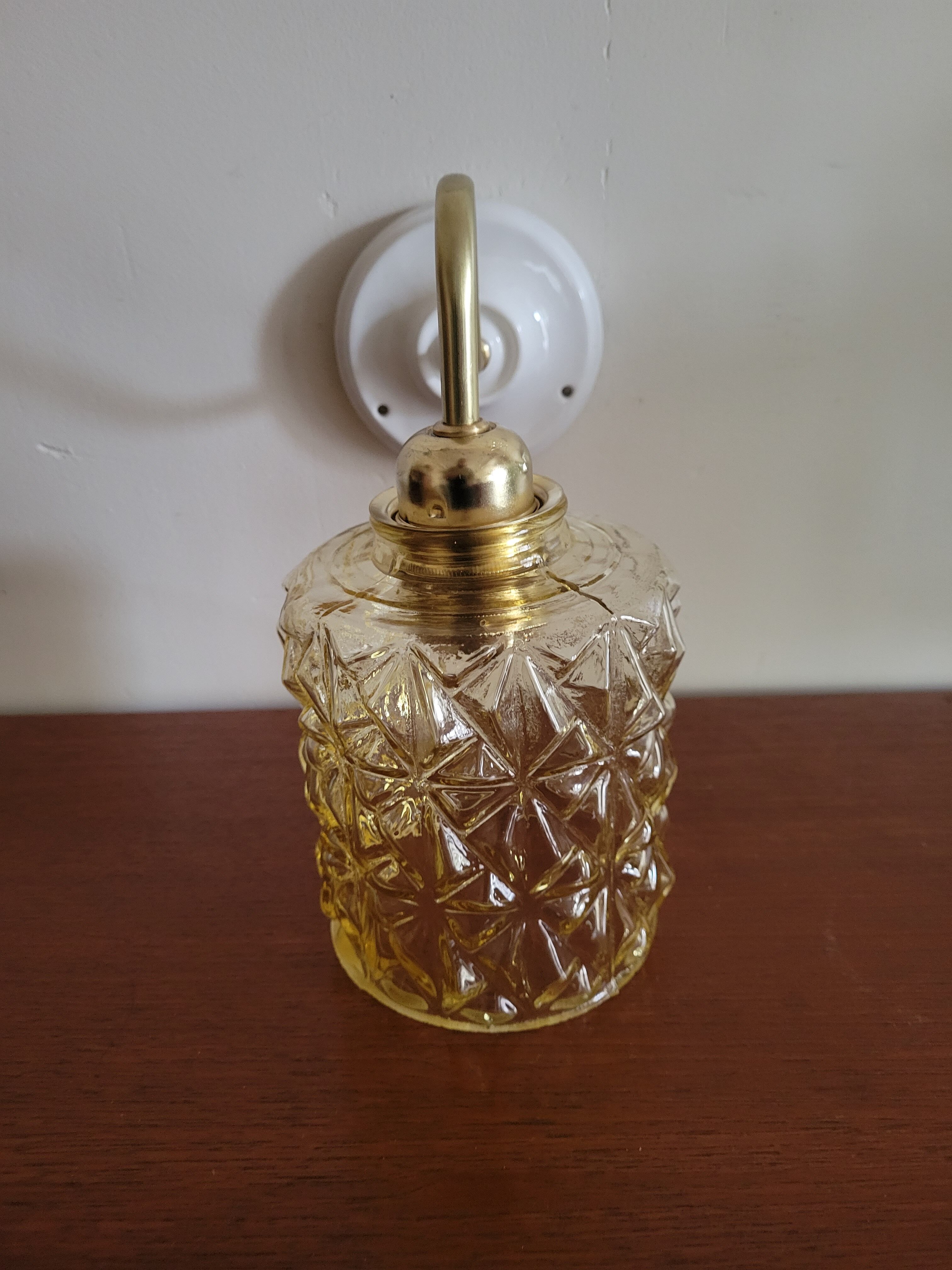 Brass wall lamp and molded glass