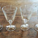 4 old digestive glasses decorated with vines