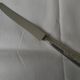 Set of 12 knives with silver metal handles and stainless steel blades.