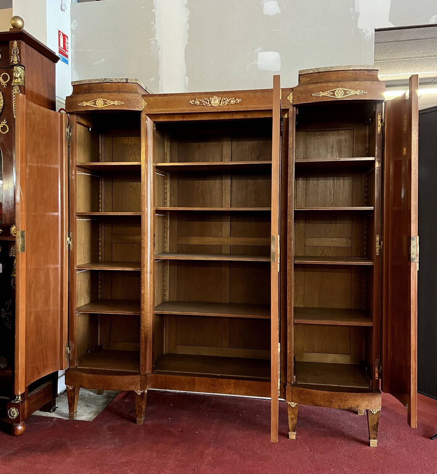 Louis XVI Style bookcase curved in precious wood marquetry circa 1900