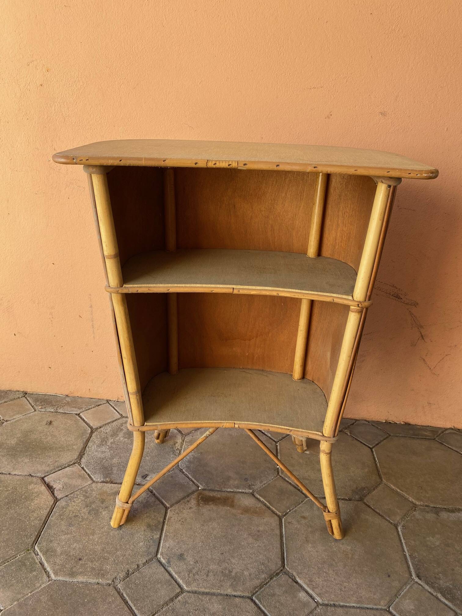 Vintage rattan bar from the 60s with rounded shapes and a shelf for glasses
