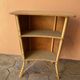 Vintage rattan bar from the 60s with rounded shapes and a shelf for glasses