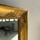 Miroir doré style Restauration à décor de palmettes étirées