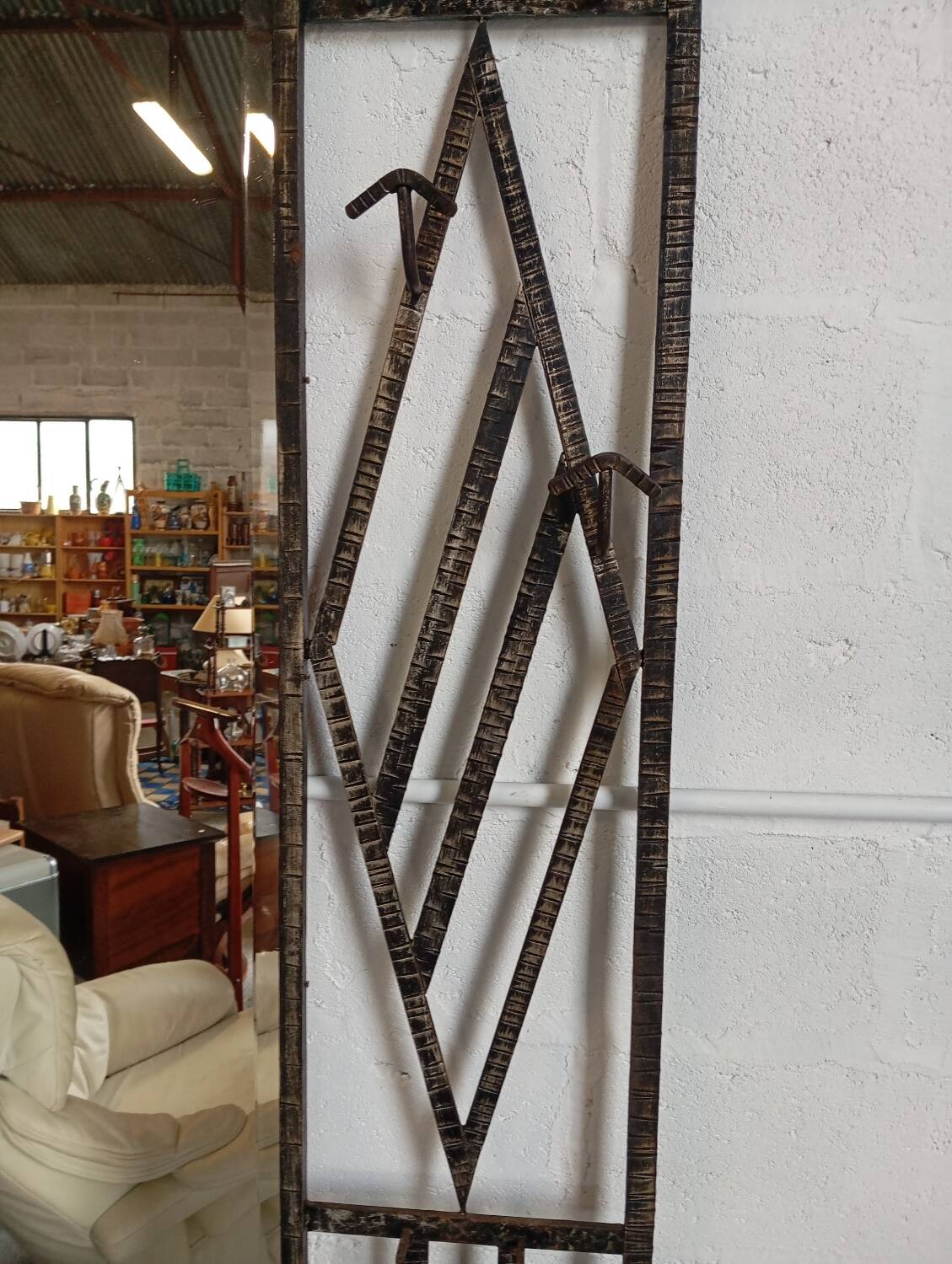 Exceptional and imposing hall wardrobe in hammered wrought iron.