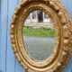 Miroir ancien en bois doré