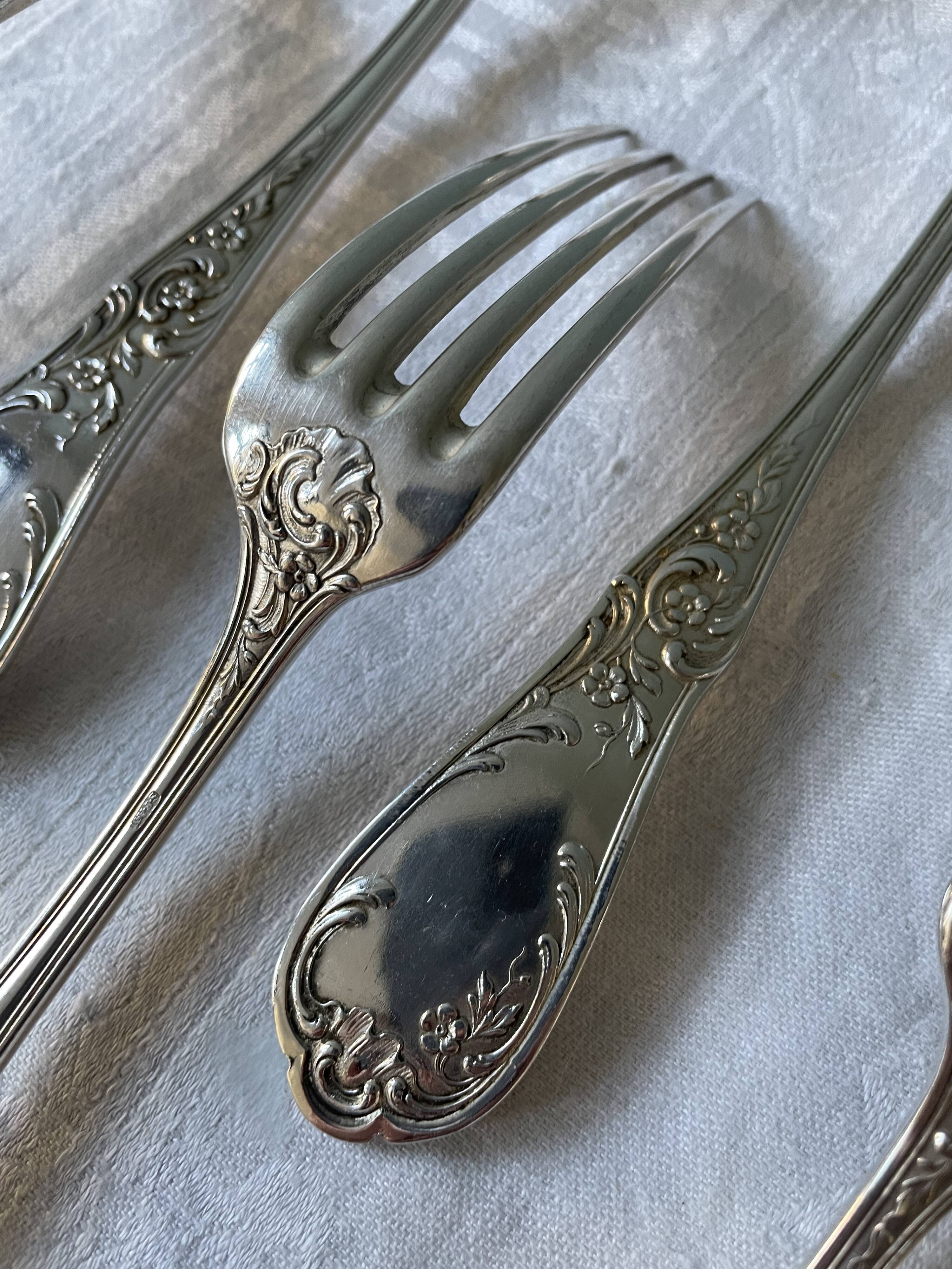 Series of 21 antique silver metal table forks