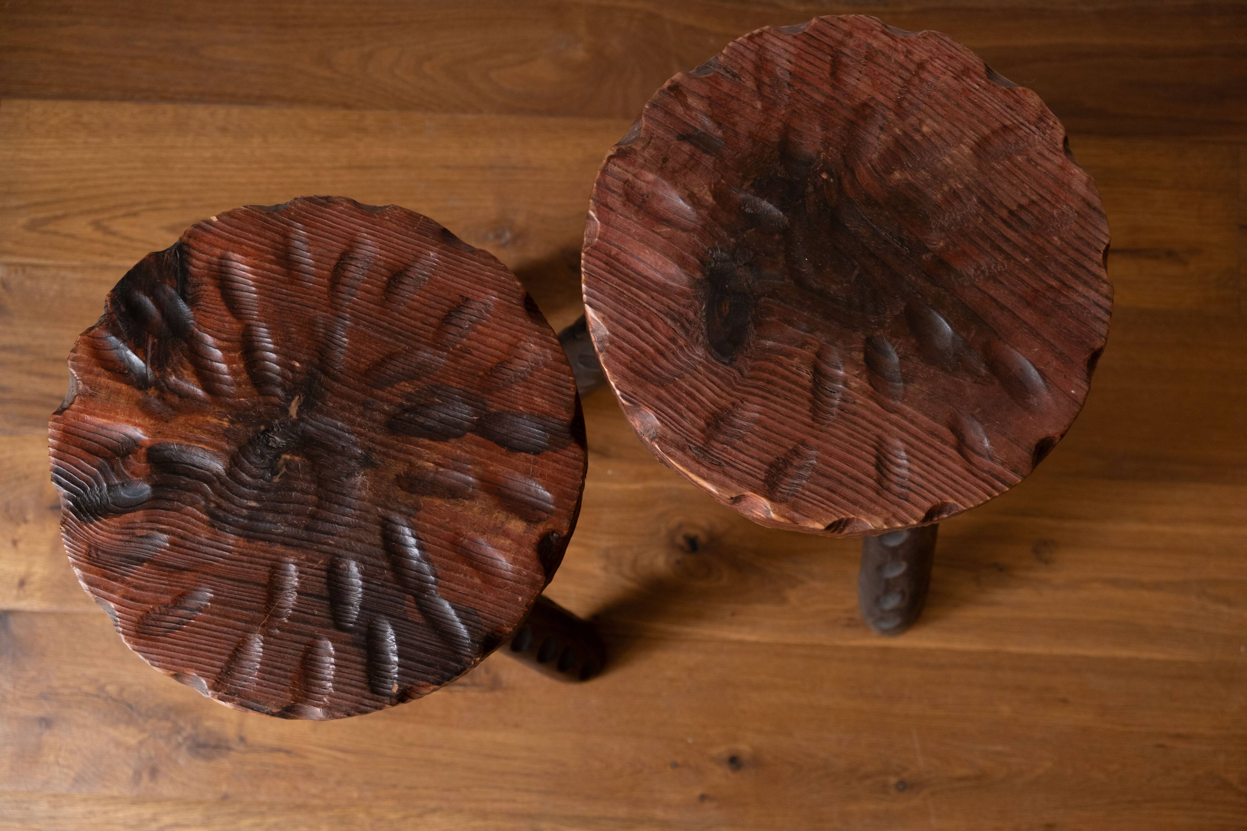 Set of two vintage round tripod stools, wooden farm stools.