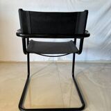 Set of 12 vintage chairs in black leather and tubular steel – Italy, 1970s