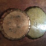 Two Florentine round table tops.