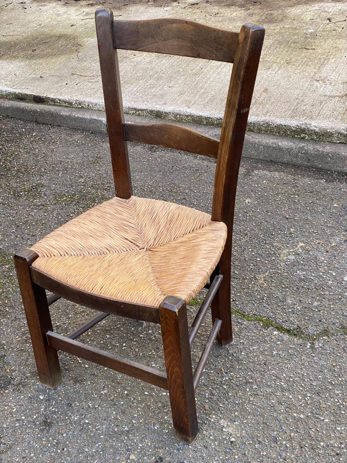 Solid wood chair in dark oak with rush seating, Louis Philippe style.
