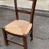 Solid wood chair in dark oak with rush seating, Louis Philippe style.