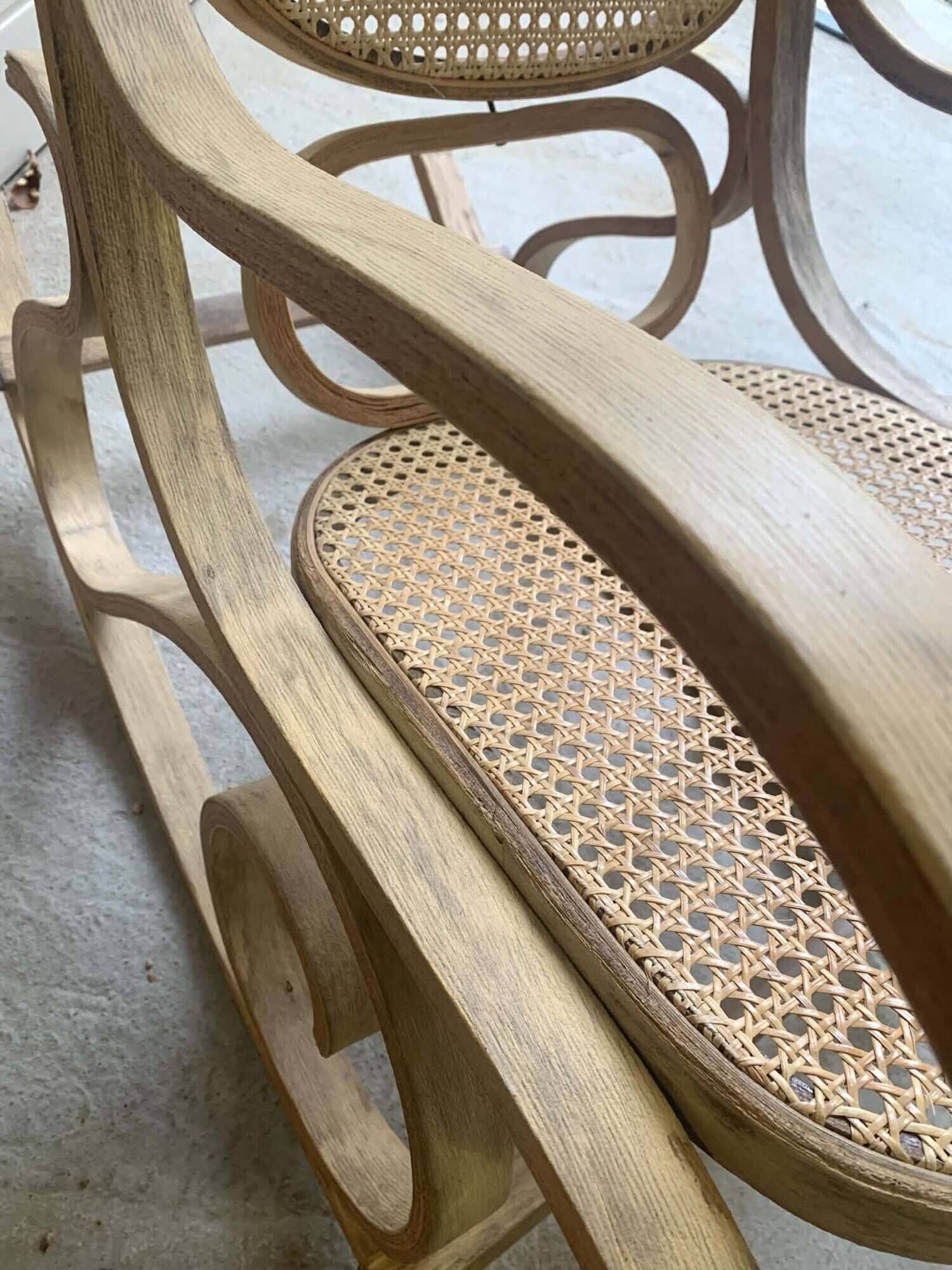 Rocking chair with a cane seat and backrest.