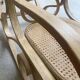 Rocking chair with a cane seat and backrest.