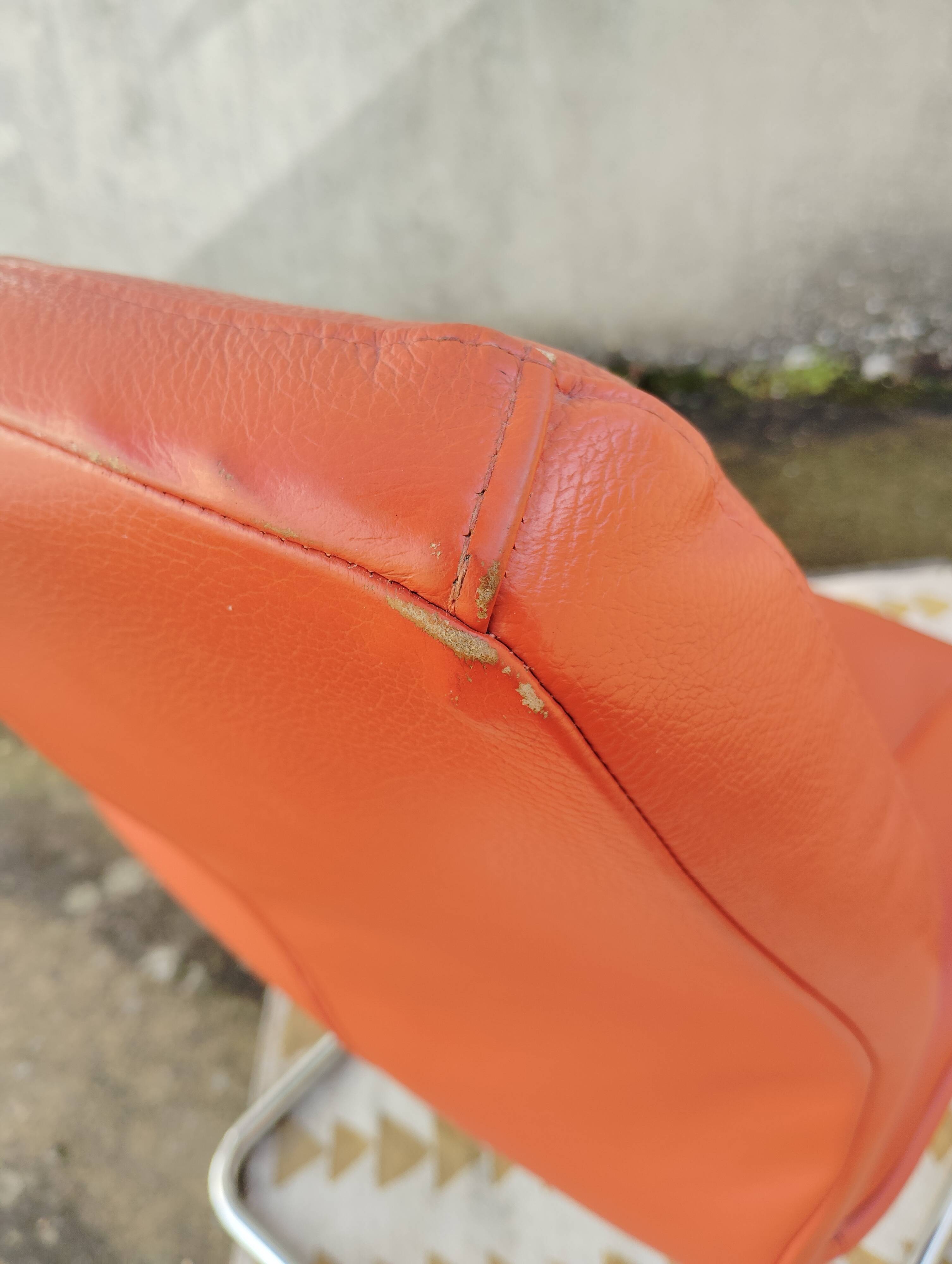Orange leather cantilever tubular armchair