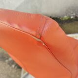 Orange leather cantilever tubular armchair