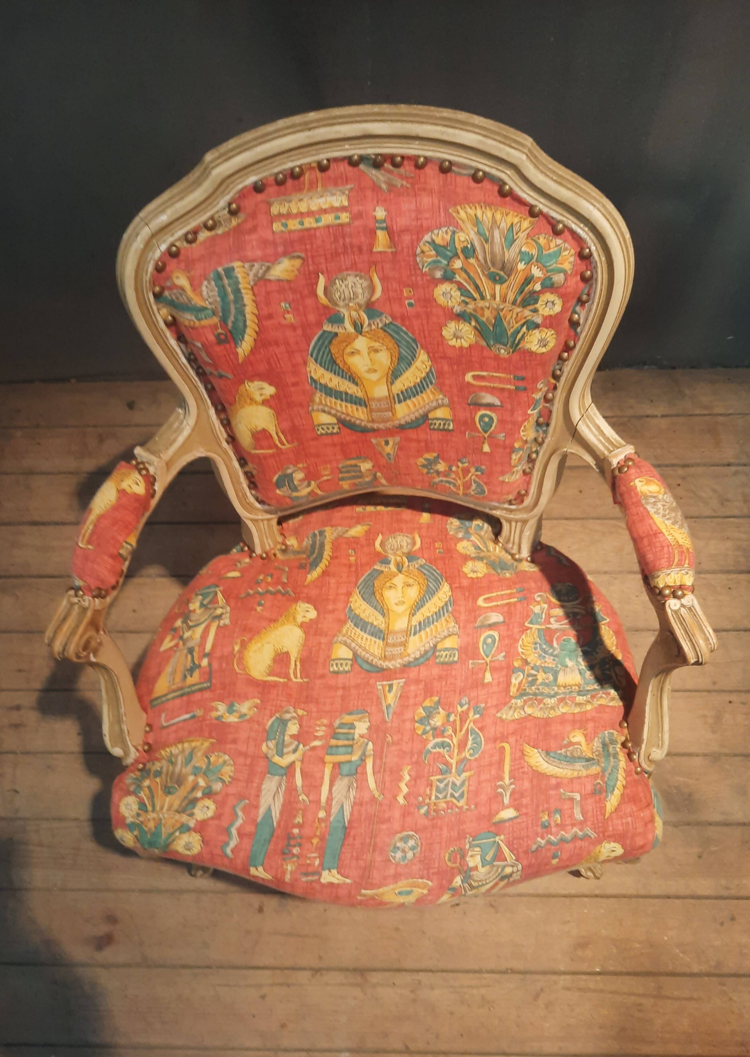 Louis XV style armchair upholstered with an Egyptian pattern.