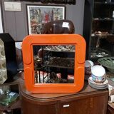 Small orange vintage mirror.