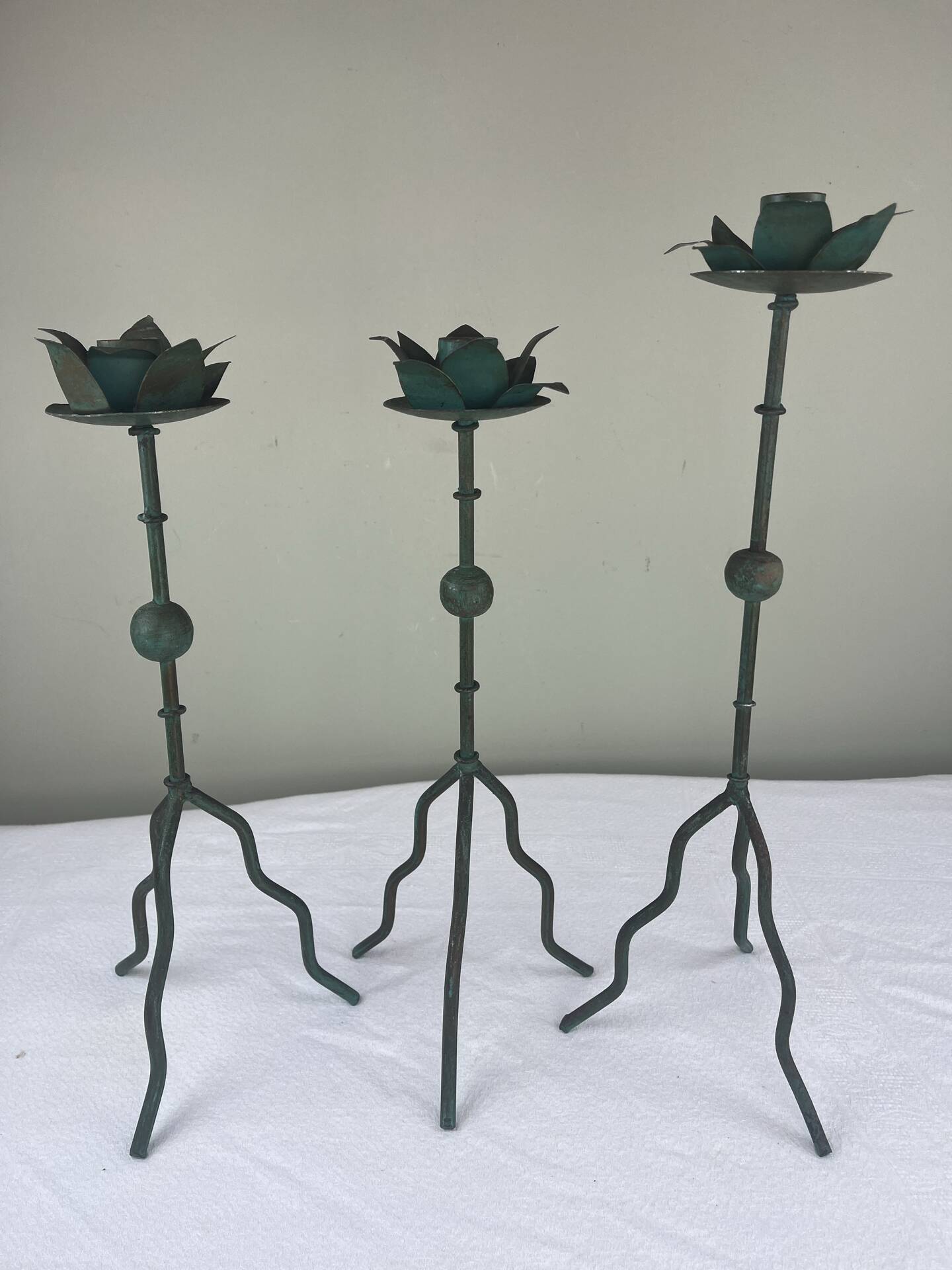 Sculptural candle holder trio