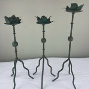 Sculptural candle holder trio